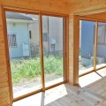 リビングを中心としたオール無垢材の家の大きな窓｜小山市の注文住宅,ログハウスのような木の家を低価格で建てるならエイ・ワン