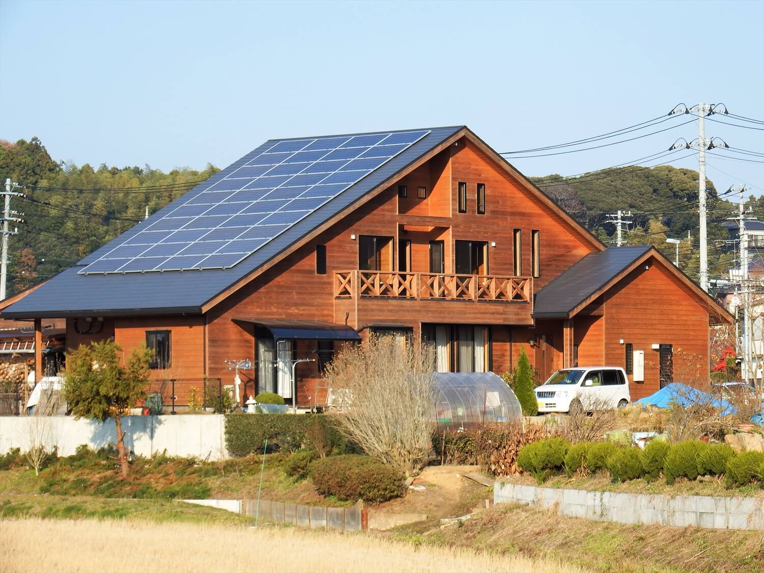 和室や薪ストーブのある二階建てログハウスの外観｜鉾田市の注文住宅,ログハウスのような低価格住宅を建てるならエイ・ワン